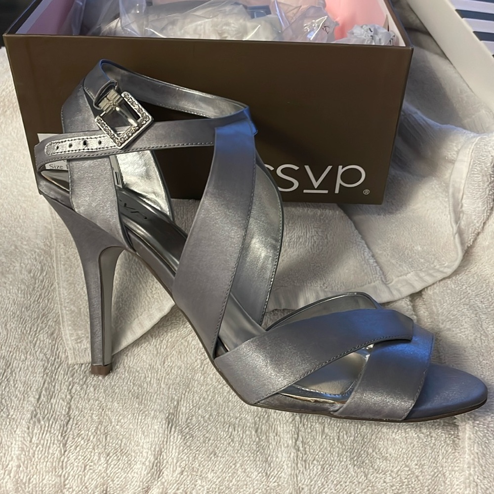Silver high heeled sandal    Never worn new in box. Diamond on buckle size 11